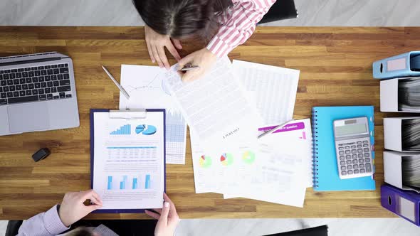 Businesswoman Signs Contract and Shakes Hands with Partner View From Above