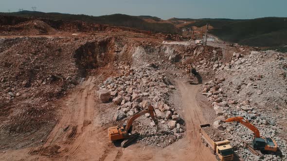 Trucks and Excavator Working