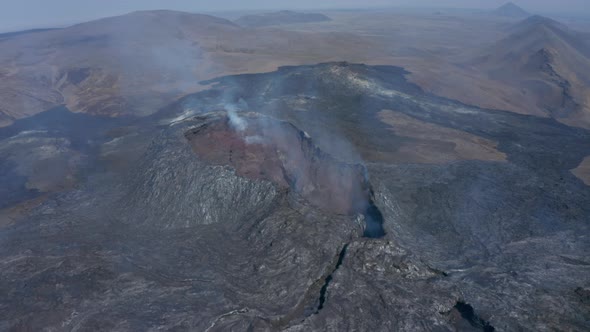 Aerial Drone Flying Backwards Above Fagradalsfjall Volcano Reveal Majestic Lava Icelandic Landscape