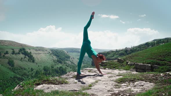 Athletic Woman Stretching Against Stunning Mountain Landscape