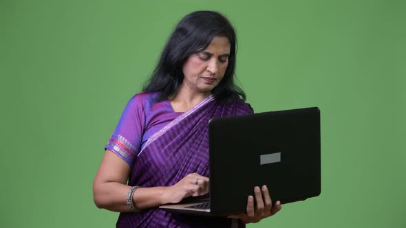 Mature Beautiful Indian Woman Using Laptop