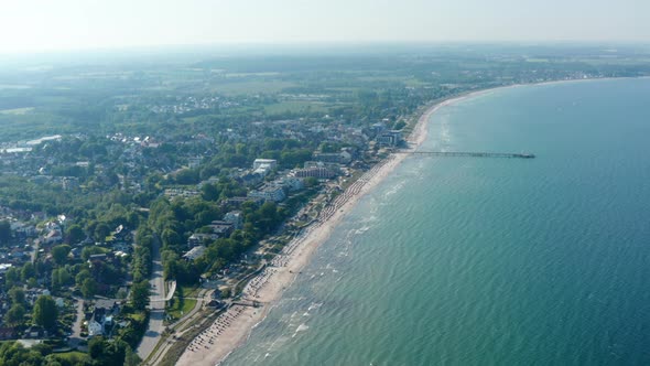 Wonderful Aerial Drone View of Baltic Sea Coast Shoreline in Scharbeutz Germany Circle Pan Sunny