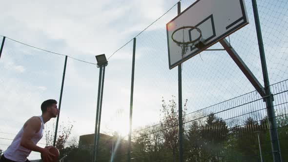 Basketball player jumping and shooting