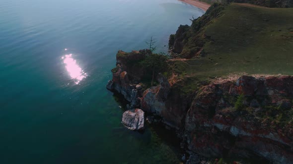 Aerial Drone Footage. Summer. Lake Baikal. Olkhon Island. Rocks in the Siberia. Cape Burkhan