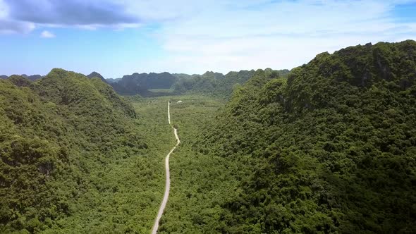 Aerial View Valley Crossed By Modern Road Among Mountains