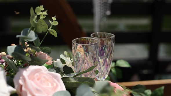 glasses with flowers near the wedding ceremony in summer