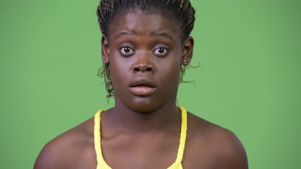 Young African Woman Looking Shocked