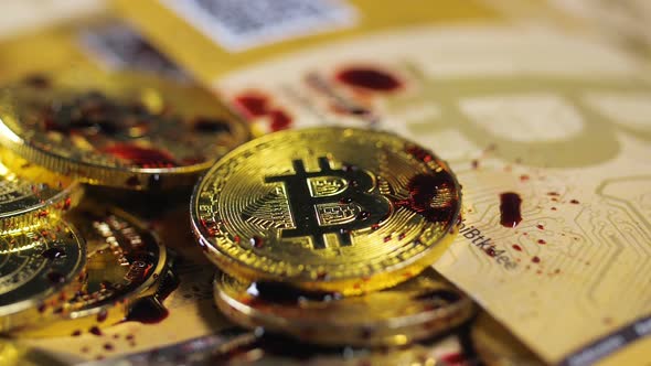 Red Paint Drops Fall Down on Bitcoin Models and Cash