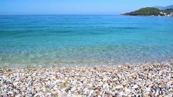 Beautiful pebble beach of Himare town. Ionian sea. Albania.