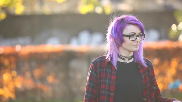 Portrait of alternative young woman in London at park