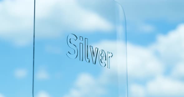 Glass Silver Lettering and Clouds in the Background alt
