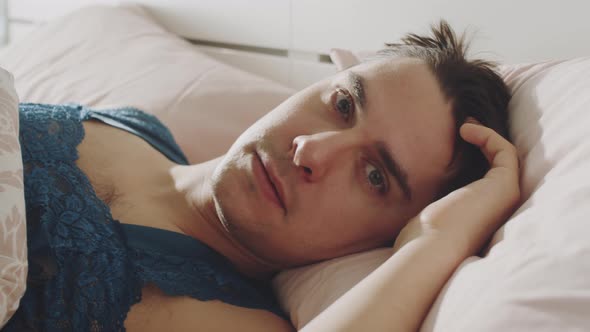 Portrait of Transgender Man in Bed