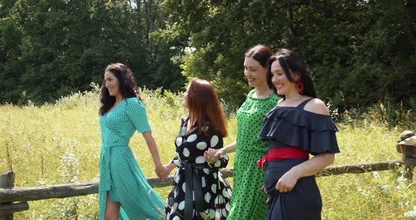 Joyful Girls Are Walking In Nature