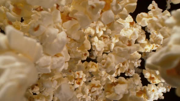 Super Slow Motion Shot of Fresh Fluffy Popcorn Flying Towards the Camera at 1000Fps