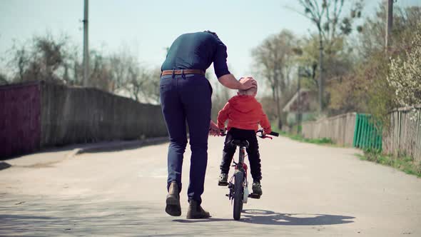 Happy Family Father And Child Boys Leisure. Son Boys Walking Happiness. Cute Little Kid Having Fun.