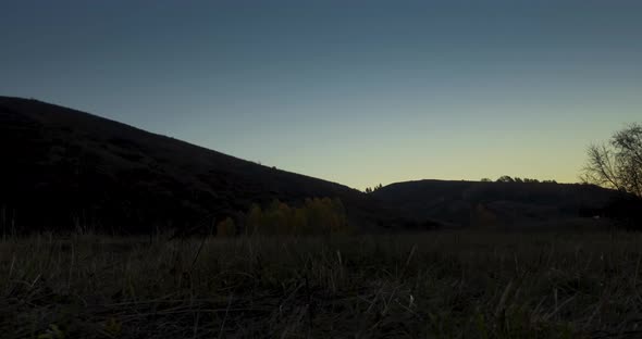 Mountain Meadow Timelapse at the Summer or Autumn Sunrise Time