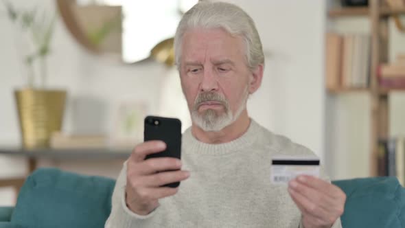 Old Man Reacting to Online Payment Failure on Smartphone