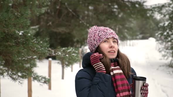 Young Woman Walking in the Winter Park