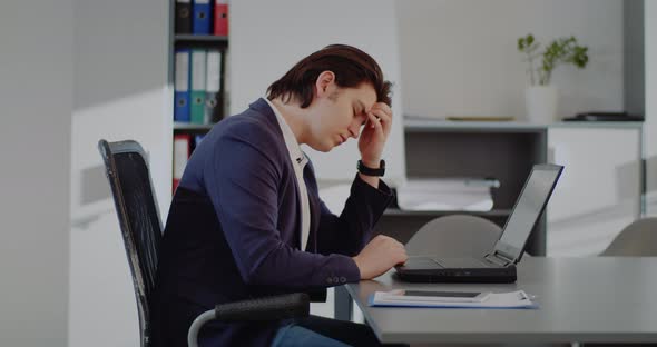 Tired Businessman Working in Office