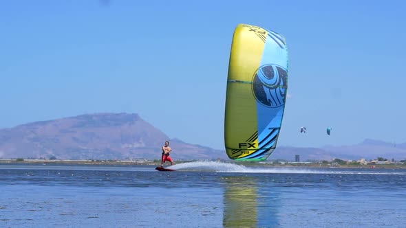 A man kiteboarding on a kite board.