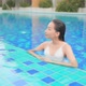 Young asian woman enjoy around outdoor swimming pool for leisure - VideoHive Item for Sale