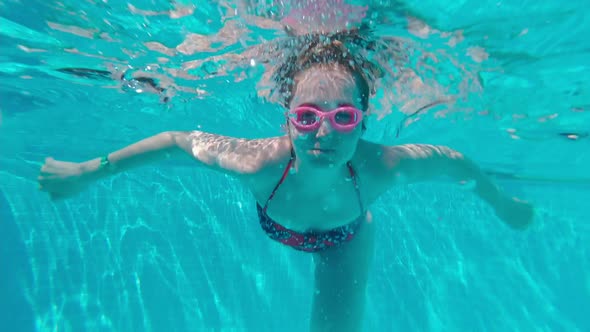 Woman Dives With Glasses