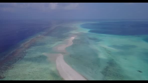 Aerial flying over panorama of paradise resort beach vacation by aqua blue sea with clean sandy back