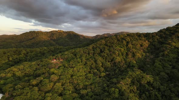 Cinematic orbiting drone video of epic cloudscape over private property on a mountain ridge within l