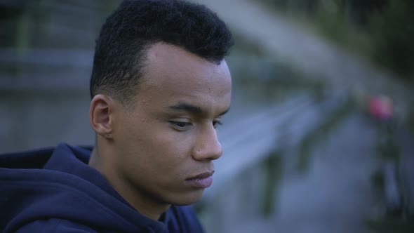 Closeup of Pensive Afro-American Teenager Thinking Over Future Prospects