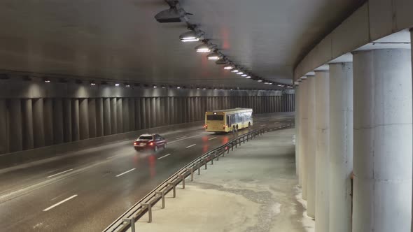 Cars Driving Through City Tunnel