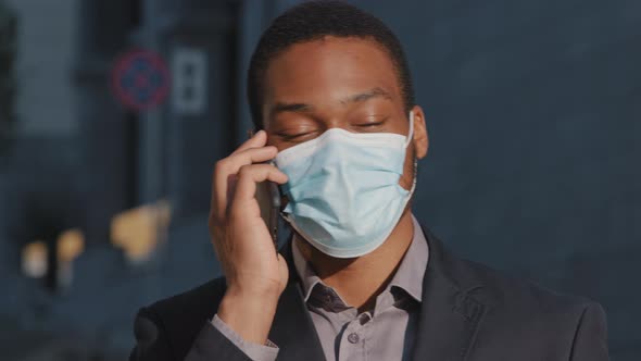 Young Adult Mixed Race Professional Wearing Medical Face Mask Businessman Making Business Call