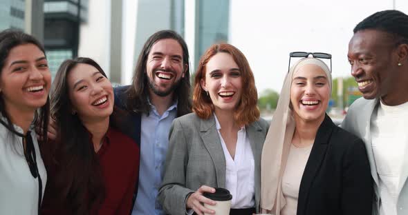 Multiracial business people smiling on camera outdoor