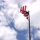 4K American flag - star and stripes floating over a cloudy blue sky - VideoHive Item for Sale