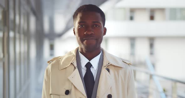 Portrait of Handsome African Businessman in Formal Suit and Coat