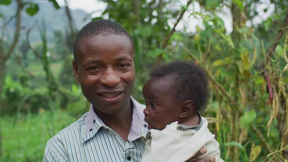 Father holding his little baby