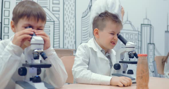 Pupil Looking Through Microscope at the Elementary School