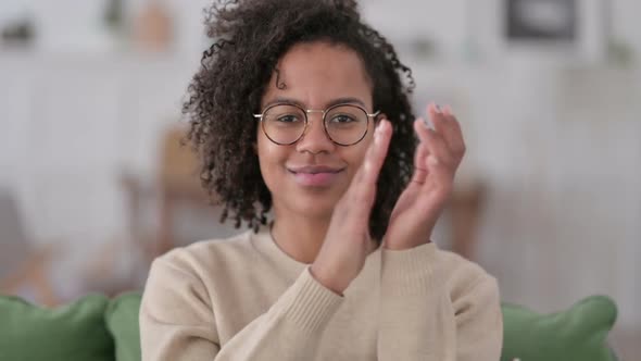 Portrait of Positive African Woman Clapping at Home