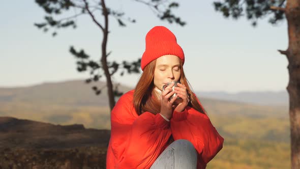 Portrait of Happy Tourist Woman Drinking Tea on Peak of Mountains.