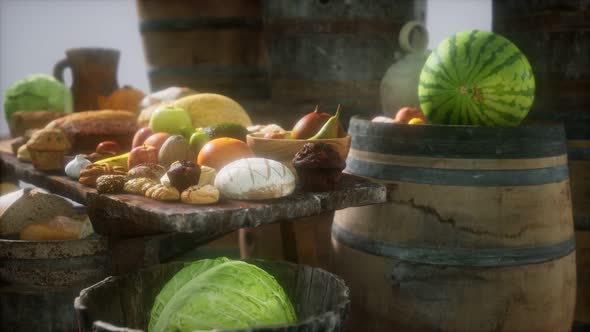 Food Table with Wine Barrels and Some Fruits, Vegetables and Bread