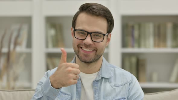 Portrait of Thumbs Up Sign By Young Man