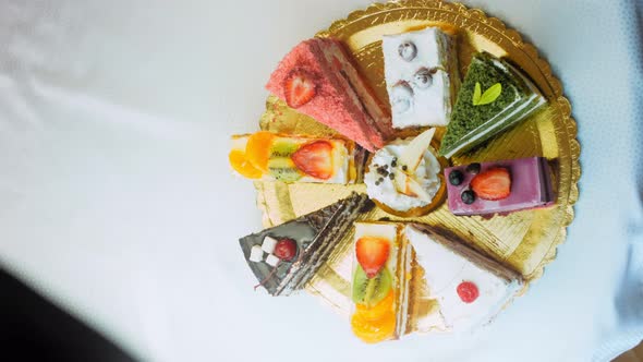 Pieces of Different Cakes on a Retrostyle Baking Tray