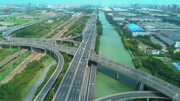 Aerial Drone Orbital View of Highway Multilevel Junction Road with Moving Cars at Daytime