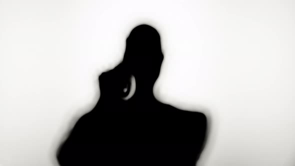 Man Holding Gun Closeup Shadow Silhouette of Hand with Pistol