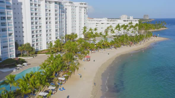 Marbella seafront hotel, Hemingway beach, Juan Dolio in Dominican Republic. Aerial sideways