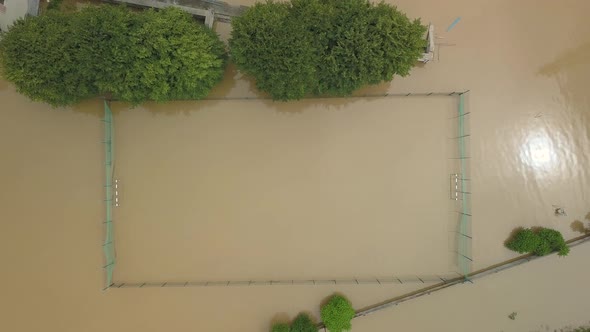 Flooded Soccer Field During a Severe Flood. Aerial Video. From the Water You Can See Only the Top of