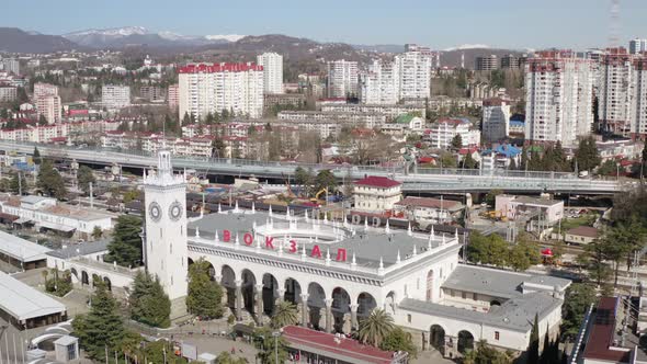 Shooting From Helicopter Flying Over Touristic City Sochi with Building Architecture and Traffic