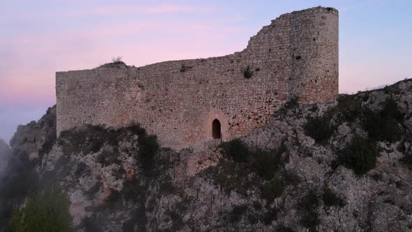 Aerial View of a Medieval Castle in a Beautiful Foggy Sunset Poza De La Sal Burgos Spain