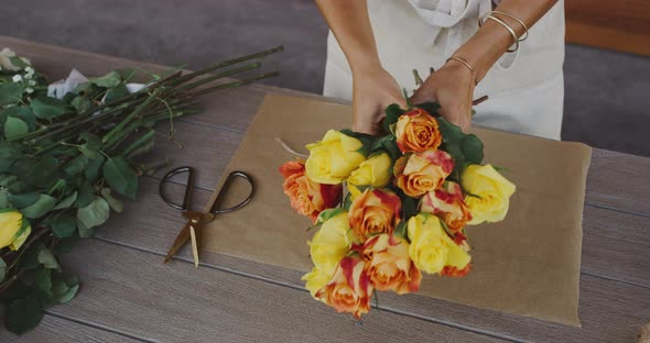 Florist preparing flower bouquet