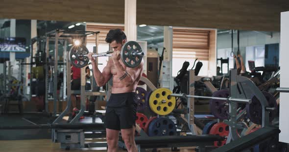 Concentrated Brutal Athletic Man in a Gym Class