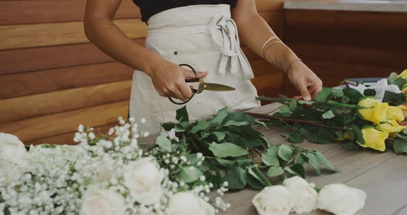 Florist preparing flower bouquet